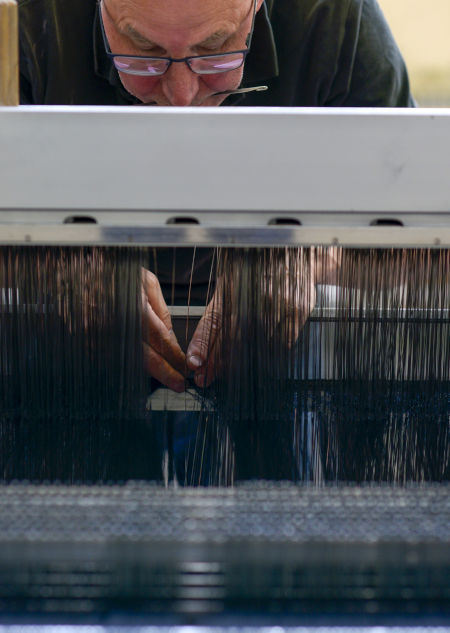 A weaver in one of Huddersfield Fine Worsteds’ mills